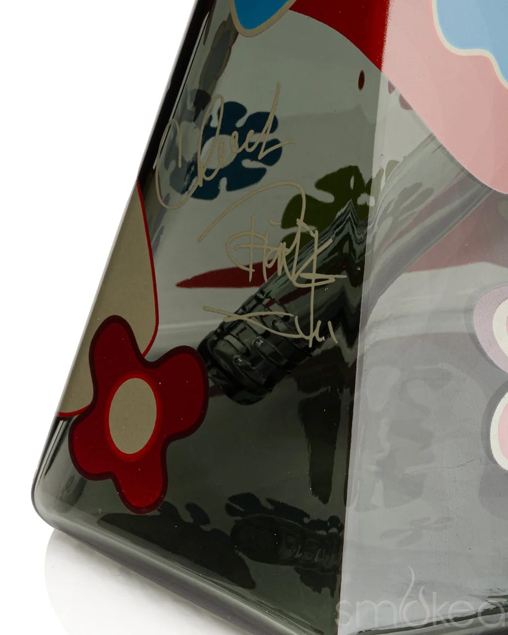 Close-up of hex beaker base showing Cheech & Chong signature decal and red floral graphic