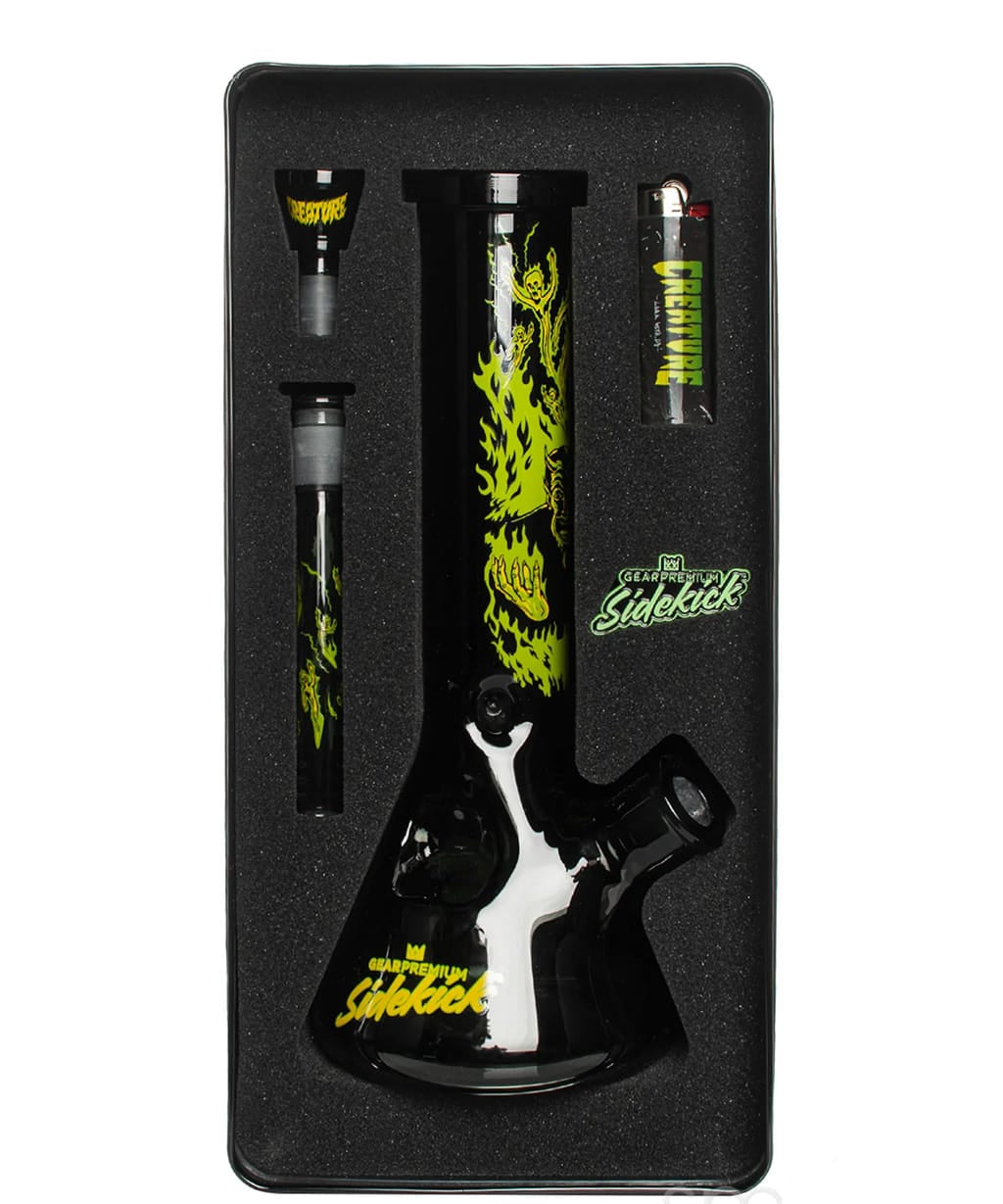 Overhead view of the GEAR Premium x Creature Hell Sidekick bong tin set with lighter and grinder accessory