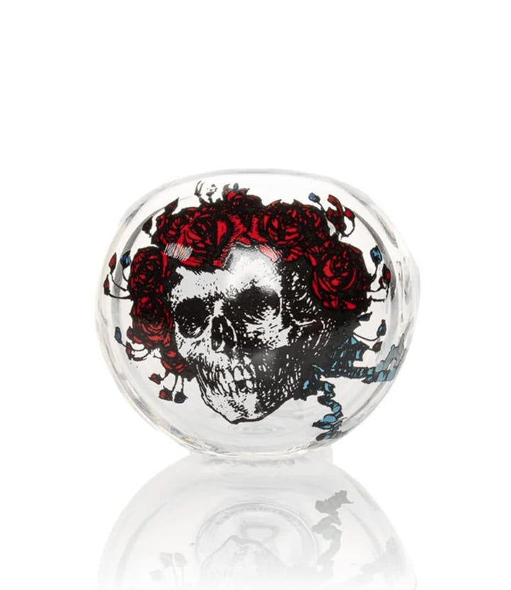 Close-up of glass spoon pipe bowl with Bertha skull and red roses decal design