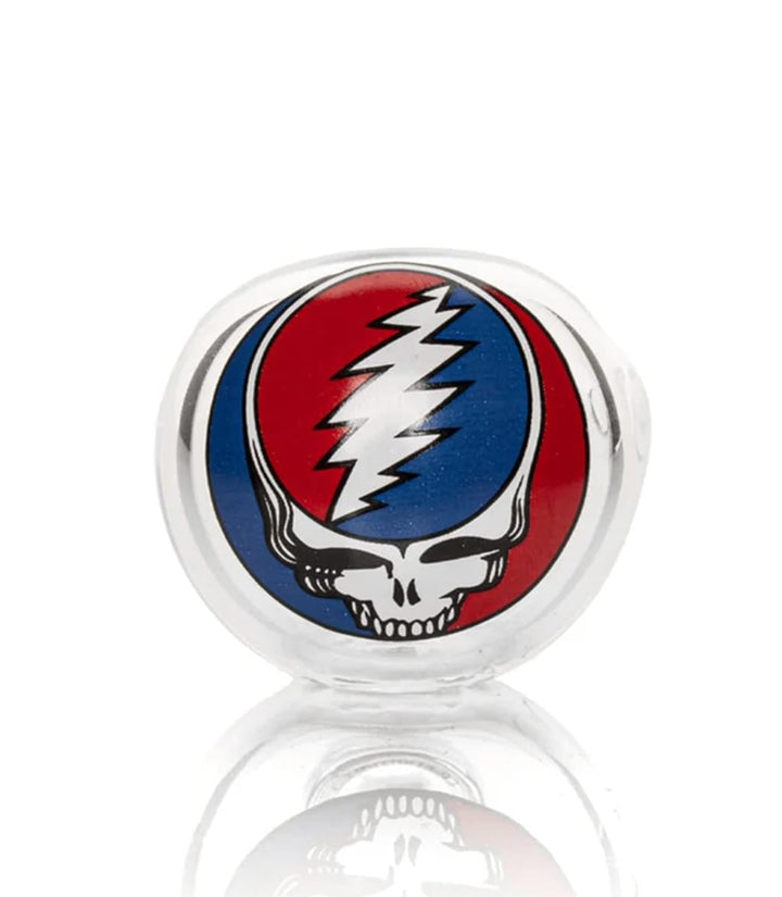 Close-up of glass spoon pipe bowl with Steal Your Face lightning bolt skull decal