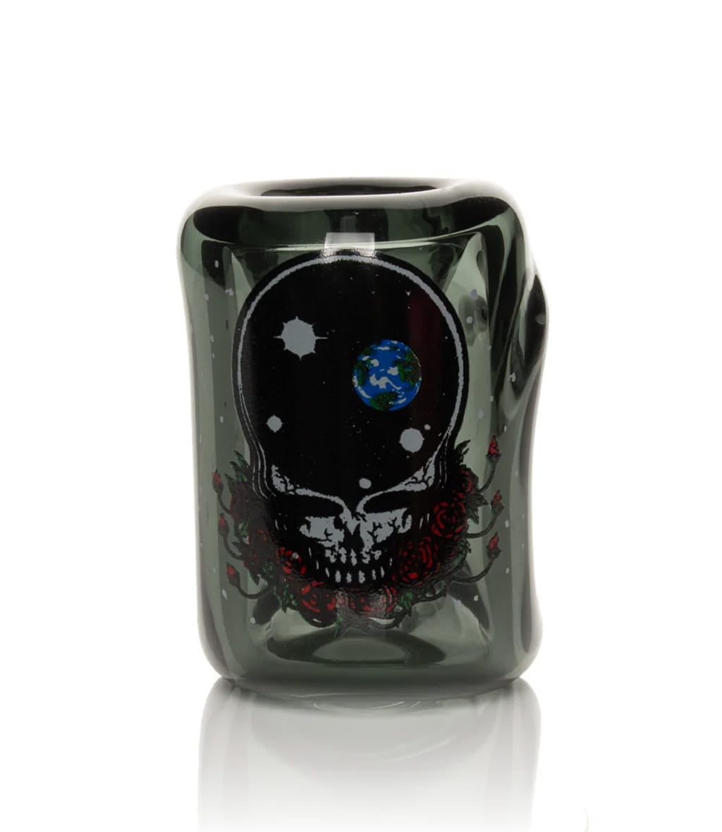 Close-up of black Grateful Dead collectible tin with Space Your Face skull, globe, and roses design