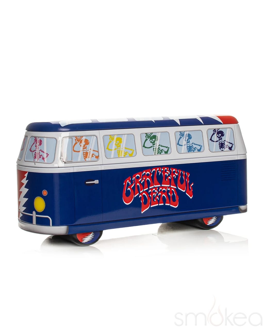 Blue Grateful Dead collectible tin shaped like a VW bus with dancing skeletons and lightning bolt design
