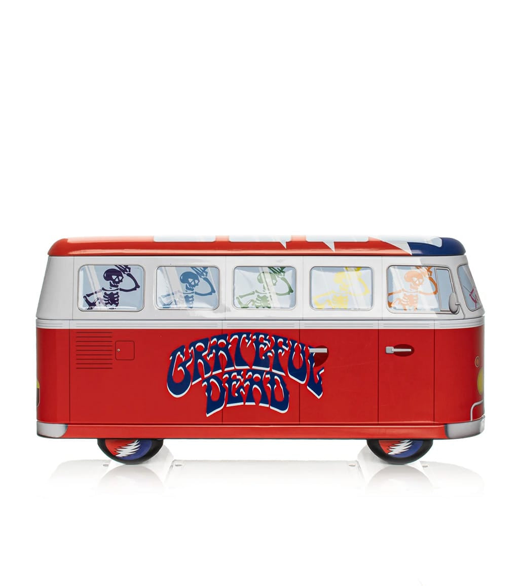 Red and white Grateful Dead collectible bus tin with dancing skeletons and Steal Your Face wheel decals